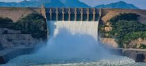 a large dam with water pouring out of it
