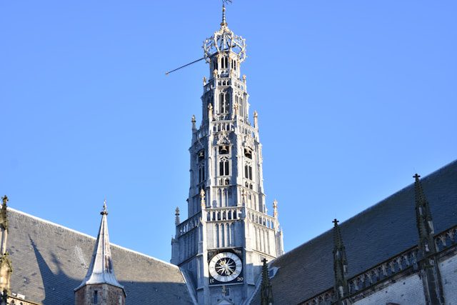 a tall building with a clock on the front of it