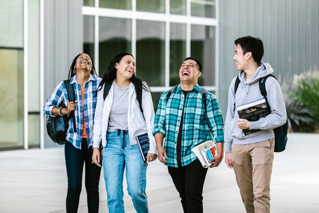 group of students walking and laughing together