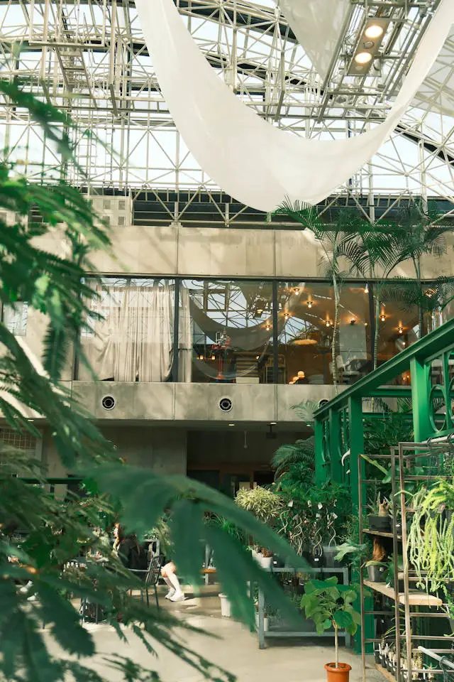 modern greenhouse with lush indoor plants
