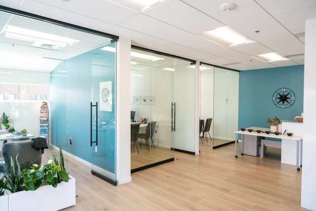 modern office space with glass walls and light decor