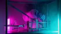 person wearing gloves holding a test tube