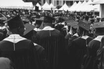 students standing in academic dress