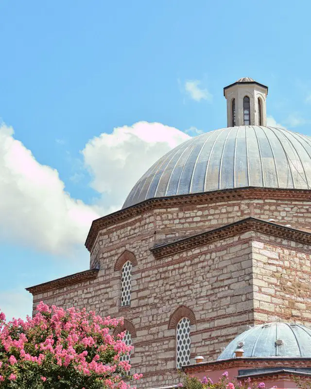 a large brick building with a dome on top