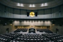 a large empty room with a large round table