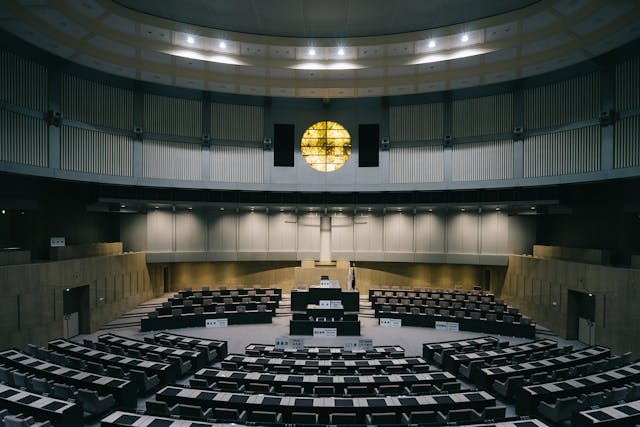 a large empty room with a large round table