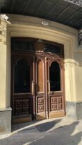 a large wooden door on the side of a building