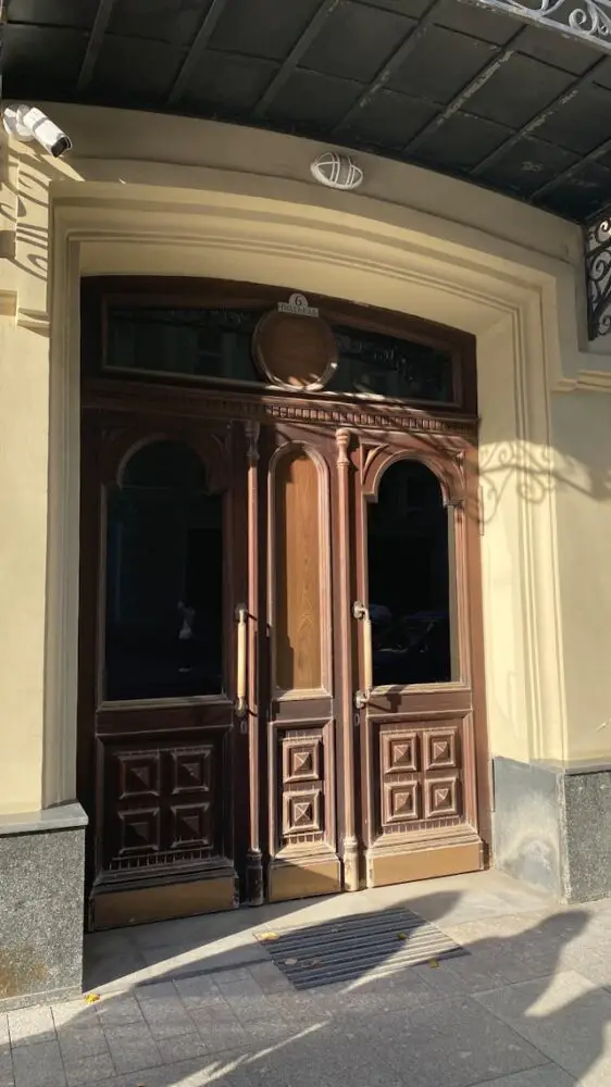 a large wooden door on the side of a building
