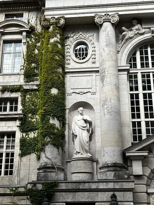 a statue in front of a building