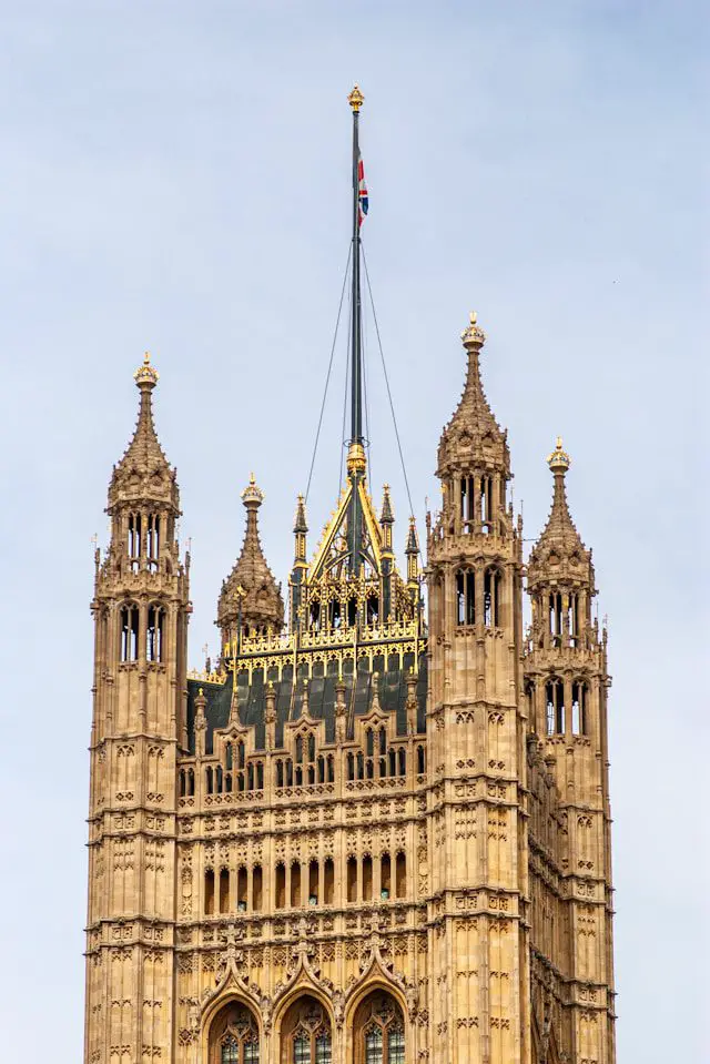 a tall building with a flag on top of it