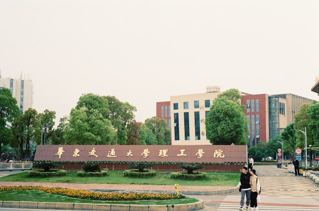 a woman standing in front of a tall building