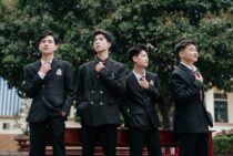 confident students in school uniform outdoors