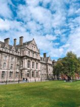 historic university building with green lawn