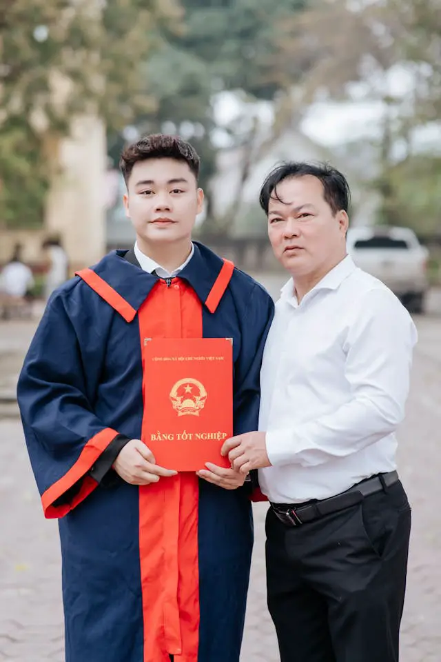 proud graduation ceremony with diploma