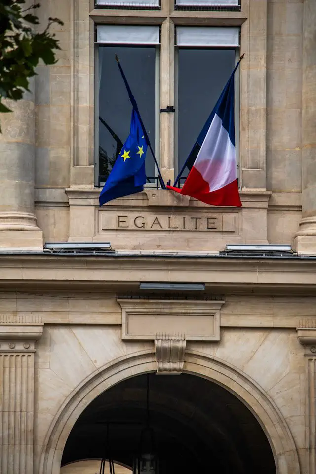 a building with two flags on top of it