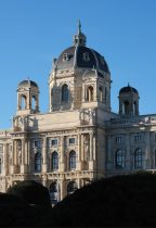 a large building with a clock on the top of it