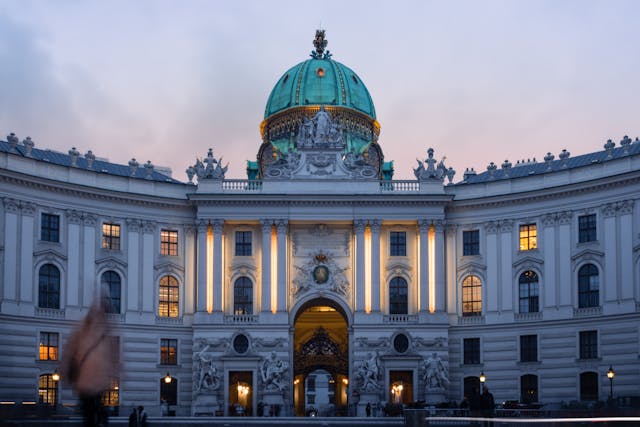 a large building with a dome and a clock