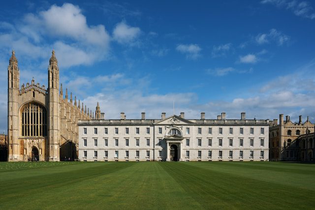 a large building with a large lawn in front of it