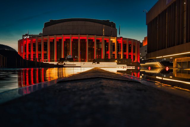 a large building with a red light on its side