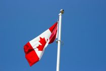 flag of canada under blue sky at daytime