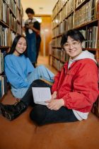 friends sitting in the library