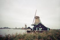 scenic windmills by the water in zaanse schans