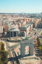 an aerial view of a city with a clock tower