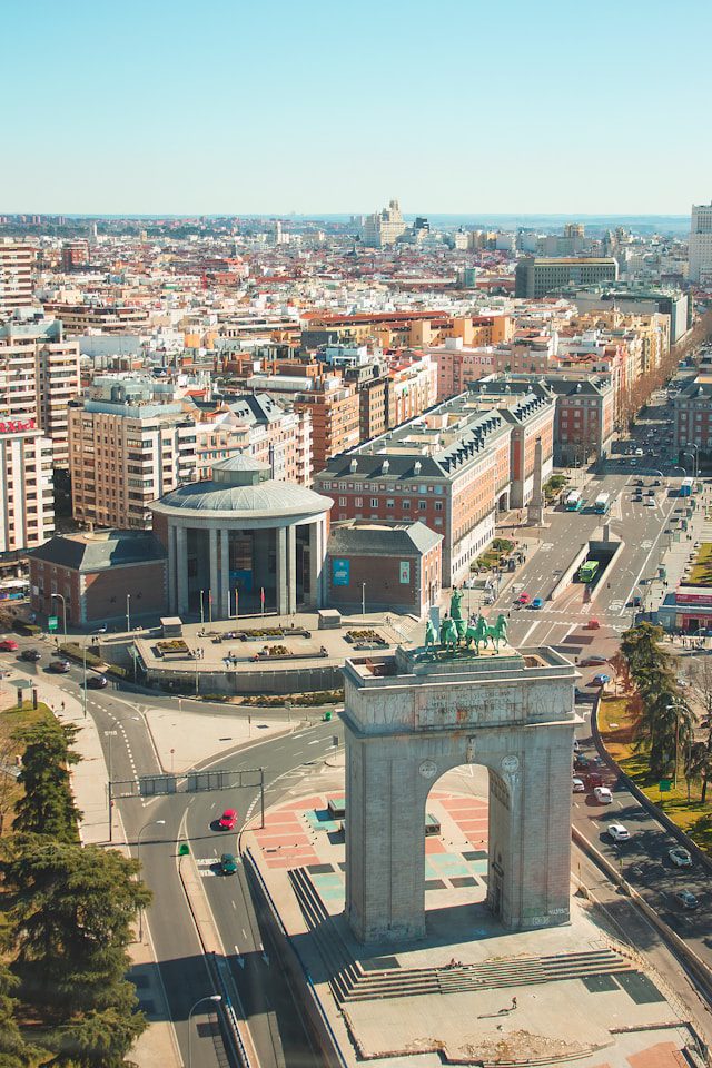 an aerial view of a city with a clock tower