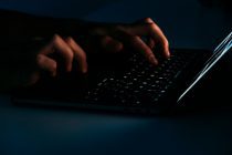 person using black laptop computer