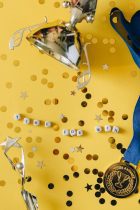 medal on ribbon golden cup statuette and dice with time for win message