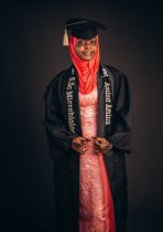 young woman in graduation attire with hijab