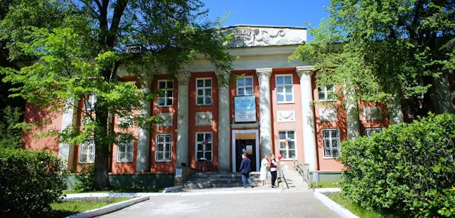 a large building with a lot of trees around it