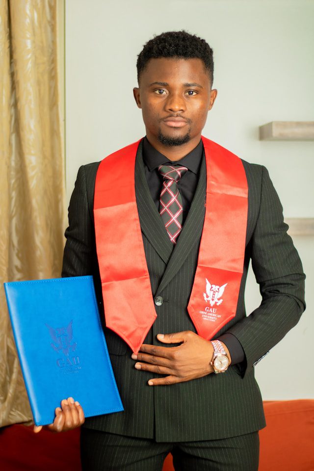 a man in a suit holding a blue folder
