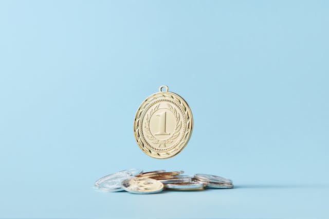 a round number pendant on a pile of coins
