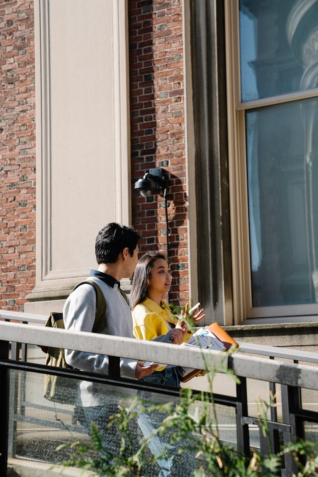 students walking by an university building