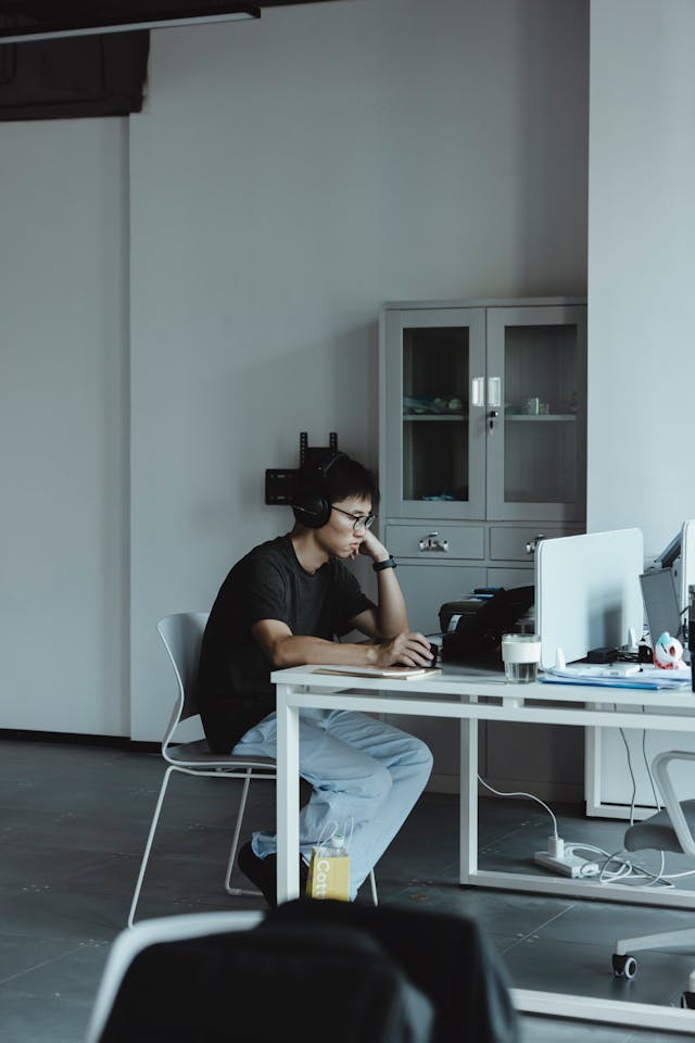 focused young professional working at desk